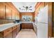 Country kitchen featuring light cabinets, ample counter space, and a window above the sink at 12721 Pleasant Hill Dr., Hemingway, SC 29554
