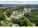 Aerial view of the community with lush trees, a golf course, and multiple residential buildings at 1428 Lanterns Rest Rd. # 1428, Myrtle Beach, SC 29579