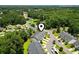 Aerial view of a tranquil neighborhood with lush greenery and a serene pond at 1428 Lanterns Rest Rd. # 1428, Myrtle Beach, SC 29579