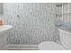 Charming half bathroom with a pedestal sink and a stylish patterned wallpaper, and neutral-toned flooring at 1428 Lanterns Rest Rd. # 1428, Myrtle Beach, SC 29579