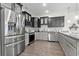 Modern kitchen featuring stainless steel appliances, granite countertops, and two-tone cabinetry at 1428 Lanterns Rest Rd. # 1428, Myrtle Beach, SC 29579