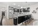 Modern kitchen boasts stainless steel appliances, granite countertops, and dark cabinetry at 1428 Lanterns Rest Rd. # 1428, Myrtle Beach, SC 29579