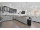 Open-concept kitchen with stainless steel appliances, granite countertops, and seamless flow into living area at 1428 Lanterns Rest Rd. # 1428, Myrtle Beach, SC 29579