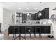 Modern kitchen with stainless steel appliances, granite countertops, and black cabinetry at 1428 Lanterns Rest Rd. # 1428, Myrtle Beach, SC 29579