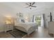 This main bedroom features a tray ceiling, ceiling fan, and balcony access through sliding glass doors at 1428 Lanterns Rest Rd. # 1428, Myrtle Beach, SC 29579