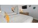 Well-lit bedroom with two beds, a dresser, and a peek of a kitchen area for convenience at 1501 S Ocean Blvd. # 1039, Myrtle Beach, SC 29577