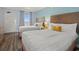 Relaxing bedroom with two beds, a serene atmosphere, and scenic views from the window at 1501 S Ocean Blvd. # 1039, Myrtle Beach, SC 29577