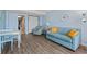 Living room with view of ocean and kitchen featuring hardwood floors, turquoise sofa and chairs at 1501 S Ocean Blvd. # 1039, Myrtle Beach, SC 29577