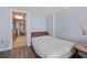 A bed within the living area with a kitchen view at 1501 S Ocean Blvd. # 1039, Myrtle Beach, SC 29577