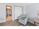Comfortable living space with a chair and view into kitchen at 1501 S Ocean Blvd. # 1039, Myrtle Beach, SC 29577