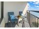 Enjoy the fresh air from this condo's balcony featuring comfortable seating and a side table at 1501 S Ocean Blvd. # 1548, Myrtle Beach, SC 29577