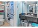 Well-lit bathroom featuring granite countertops, tiled floors, and a shower with a shark-themed curtain at 1501 S Ocean Blvd. # 1548, Myrtle Beach, SC 29577