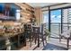 Dining Area features unique accent wall, television, and ocean view at 1501 S Ocean Blvd. # 1548, Myrtle Beach, SC 29577