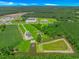Expansive aerial view showcasing the property, serene ponds, and surrounding lush landscape at 15810 County Line Rd., Andrews, SC 29510
