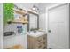 This stylish bathroom has a modern vanity, open shelving, and neutral decor at 15810 County Line Rd., Andrews, SC 29510