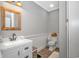 This modern bathroom has a custom vanity, neutral walls, and updated fixtures at 15810 County Line Rd., Andrews, SC 29510