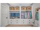 Custom closet featuring built-in shelving, drawers, hanging rods and stylish storage baskets at 15810 County Line Rd., Andrews, SC 29510