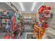 Well-organized garage with ample shelving, tool storage, a refrigerator, and a clean workspace at 15810 County Line Rd., Andrews, SC 29510