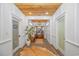 Hallway featuring brick flooring, wood ceiling, and natural light offering a welcoming transition between spaces at 15810 County Line Rd., Andrews, SC 29510