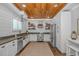 Modern kitchen featuring stainless steel appliances, ample counter space, and stylish open shelving at 15810 County Line Rd., Andrews, SC 29510