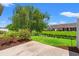 Backyard view from patio features grass and weeping willow at 1590 Palmina Loop # A, Myrtle Beach, SC 29588