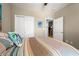 Bedroom with double closet, neutral paint, and doorway that leads to another room at 1590 Palmina Loop # A, Myrtle Beach, SC 29588