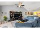 Spacious living room with large entertainment center, plush sectional sofa, and hardwood floors at 1590 Palmina Loop # A, Myrtle Beach, SC 29588