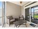 Screened-in back porch with seating, perfect for outdoor relaxation at 1590 Palmina Loop # A, Myrtle Beach, SC 29588