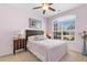 Cozy bedroom with a large window, neutral carpet, and soft pink walls at 178 Parmalee Dr. # C, Murrells Inlet, SC 29576