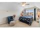 A cozy bedroom with an ocean-themed bed, nautical decorations, and a ceiling fan at 178 Parmalee Dr. # C, Murrells Inlet, SC 29576