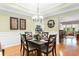 Elegant dining room with wainscoting, hardwood floors, and decorative lighting at 178 Parmalee Dr. # C, Murrells Inlet, SC 29576