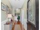 Inviting entryway featuring hardwood floors, fresh paint, decorative molding, and a charming console table at 178 Parmalee Dr. # C, Murrells Inlet, SC 29576