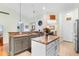 Well-appointed kitchen featuring granite countertops, a center island, and modern appliances at 178 Parmalee Dr. # C, Murrells Inlet, SC 29576