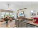 Open kitchen featuring granite countertops, stainless steel appliances, and adjacent living area at 178 Parmalee Dr. # C, Murrells Inlet, SC 29576