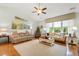 Spacious living room features large windows, hardwood floors, neutral paint, and comfortable seating at 178 Parmalee Dr. # C, Murrells Inlet, SC 29576