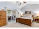 Tranquil main bedroom features a vaulted ceiling, ceiling fan, and access to the lanai at 178 Parmalee Dr. # C, Murrells Inlet, SC 29576