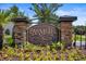 Stone community entrance sign surrounded by colorful landscaping and vibrant flowers at 178 Parmalee Dr. # C, Murrells Inlet, SC 29576