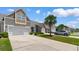 Scenic view of townhomes with well-maintained lawns, mature palm trees, and a peaceful residential street at 178 Parmalee Dr. # C, Murrells Inlet, SC 29576