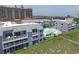 Aerial view of gray condominiums, swimming pool, landscaping, and beach access at 1820 N Ocean Blvd. # 303D, North Myrtle Beach, SC 29582