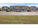 Well-maintained condominium exterior with tropical landscaping, road access, and prominent signage at 1820 N Ocean Blvd. # 303D, North Myrtle Beach, SC 29582