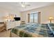Cozy bedroom with large window, dresser with TV and comfortable seating at 1820 N Ocean Blvd. # 303D, North Myrtle Beach, SC 29582