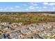 Birds-eye view of a community featuring blue townhomes near a heavily wooded area at 1857 Culbertson Ave. # 1857, Myrtle Beach, SC 29577