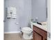 Standard full bathroom featuring a dark wood vanity, white sink and toilet, and decorative towels at 1857 Culbertson Ave. # 1857, Myrtle Beach, SC 29577