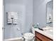 Standard full bathroom featuring a dark wood vanity, white sink and toilet, and decorative towels at 1857 Culbertson Ave. # 1857, Myrtle Beach, SC 29577