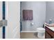 Bathroom featuring a white toilet, vanity with dark cabinets, and tiled floors at 1857 Culbertson Ave. # 1857, Myrtle Beach, SC 29577
