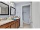 Bathroom showcasing double vanity with granite countertop, dark wood cabinets, and tiled floors at 1857 Culbertson Ave. # 1857, Myrtle Beach, SC 29577