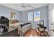 Bedroom features hardwood floors, neutral paint, natural light, and a ceiling fan at 1857 Culbertson Ave. # 1857, Myrtle Beach, SC 29577