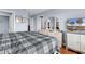 Bedroom featuring a large bed, a TV, an array of doors and a large dresser at 1857 Culbertson Ave. # 1857, Myrtle Beach, SC 29577