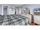 Bedroom featuring a large bed, a TV, an array of doors and a large dresser at 1857 Culbertson Ave. # 1857, Myrtle Beach, SC 29577