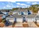 Charming blue townhomes with well-maintained landscaping and attached garages at 1857 Culbertson Ave. # 1857, Myrtle Beach, SC 29577